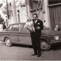 54. Ο Γεώργιος Καλλιμάνης με την κόρη του Μαρία έξω από το κατάστημα στην πλατεία Αχαϊκής Συμπολιτείας στο Αίγιο, 1972